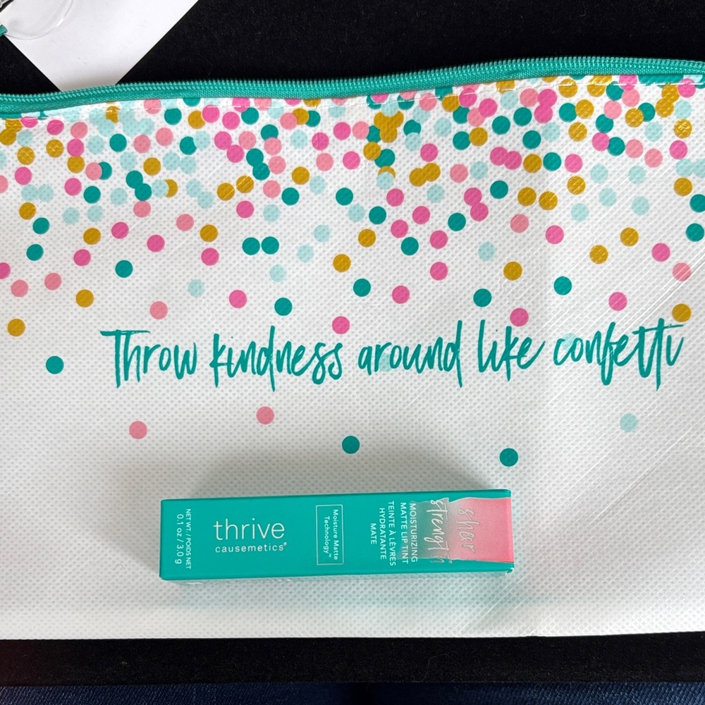 Thrive Dr. Elizabeth Petal Pink Matte Lip Tint and Makeup bag.
